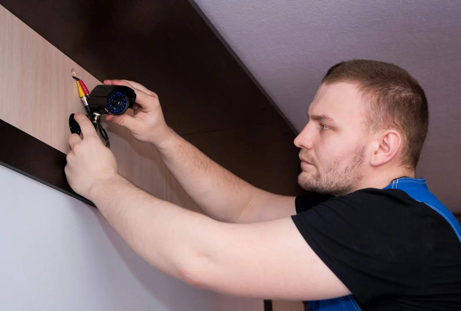 Technician fixing a door lock in a Dubai home